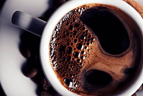 top view of a mug of black coffee